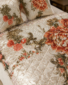 Close fabric and floral detail of Ivory Rust Bloom Printed Silk bedding