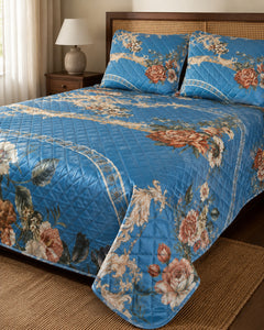 Side-angle view of sapphire floral medallion printed silk bedspread set