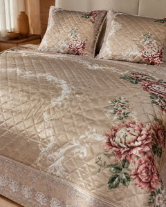 Close-up of taupe printed silk quilting, rose florals, scrollwork and border