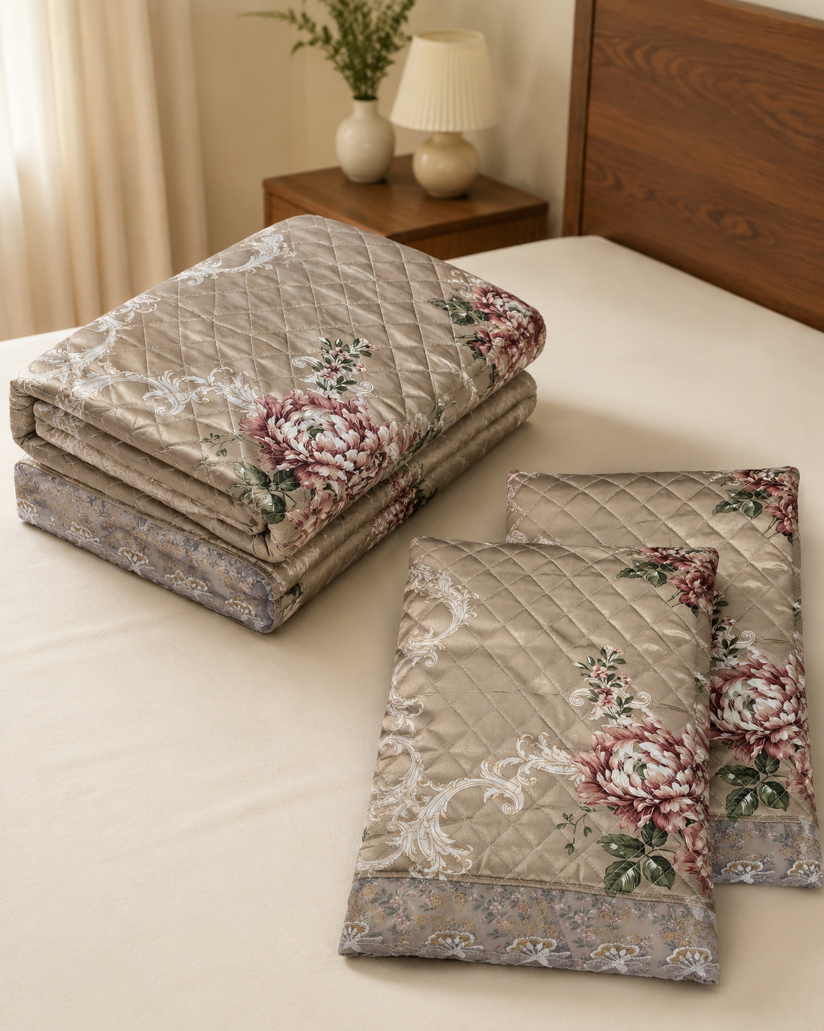 Folded taupe rose botanical printed silk three-piece bedspread set