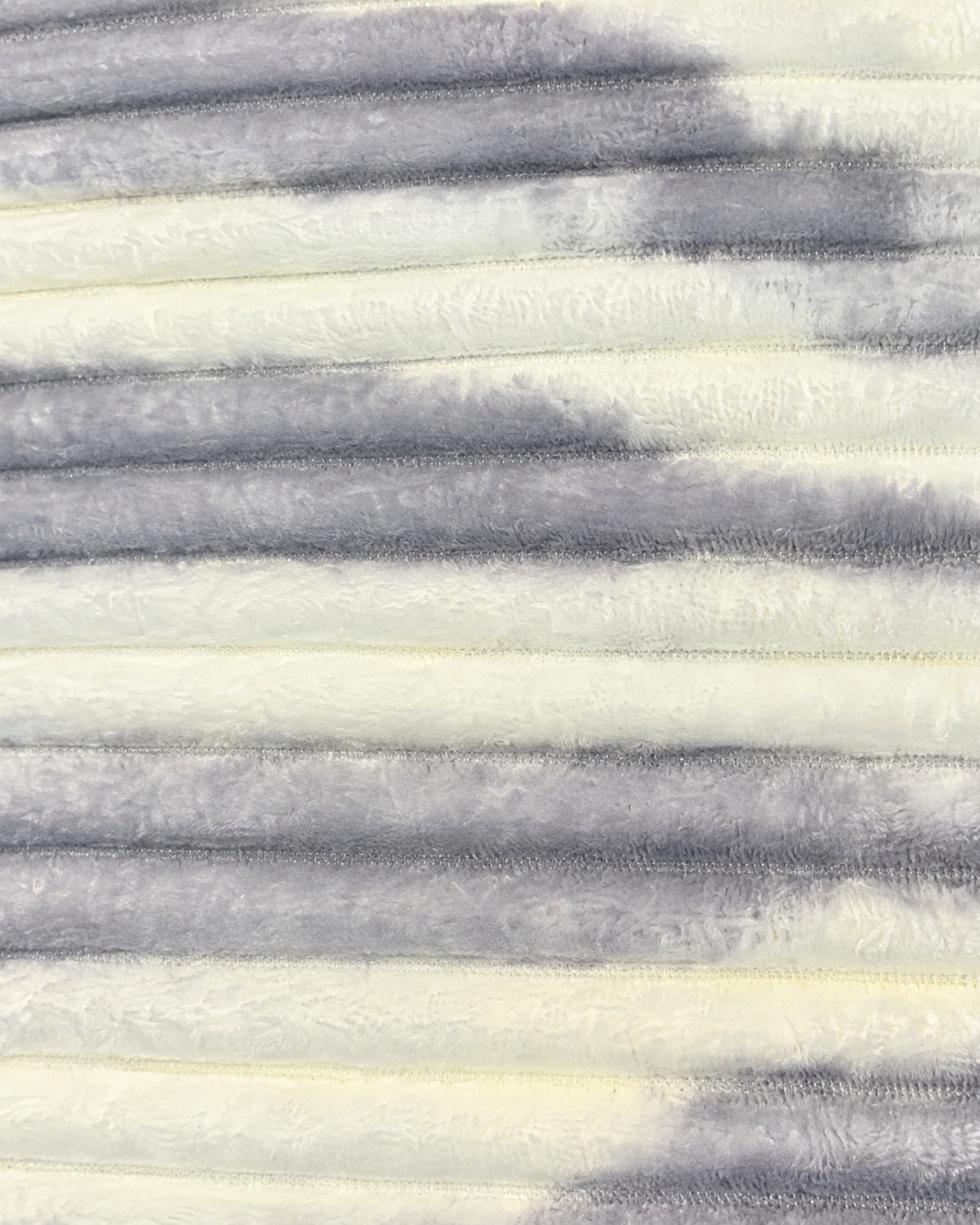 Close-up of pearl ivory and cloud grey ribbed comforter fabric