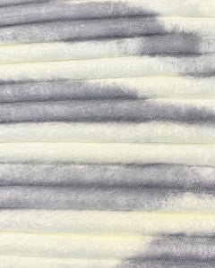 Close-up of pearl ivory and cloud grey ribbed comforter fabric