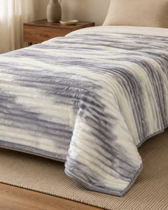 Side-angle view of cloud grey stripe Smartchoice AC comforter