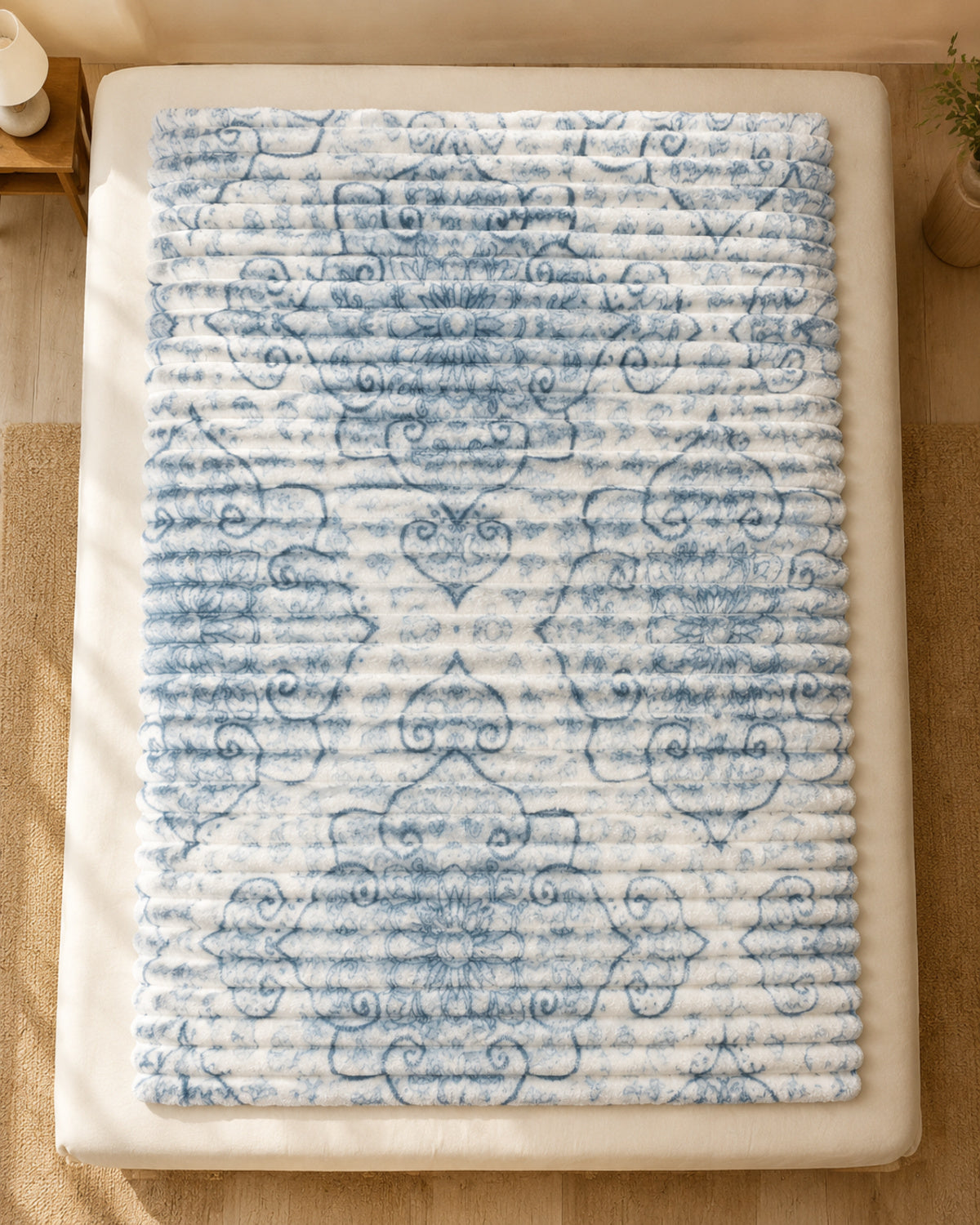 Overhead view of ivory blue heartline Smartchoice AC comforter