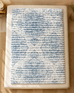 Overhead view of ivory blue heartline Smartchoice AC comforter