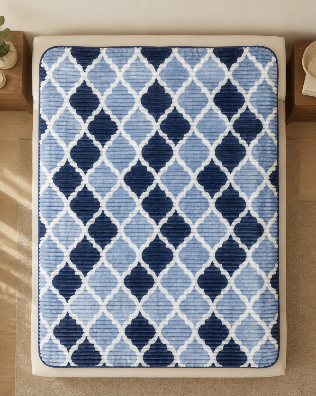 Overhead view of powder blue navy trellis Smartchoice AC comforter