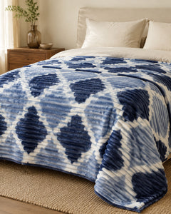 Side-angle view of powder blue navy trellis Smartchoice AC comforter