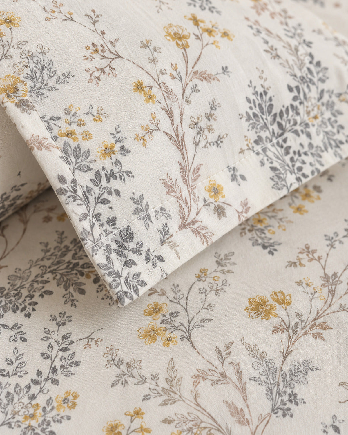 Ivory Meadow cotton weave, botanical print, stitching and pillow flange detail